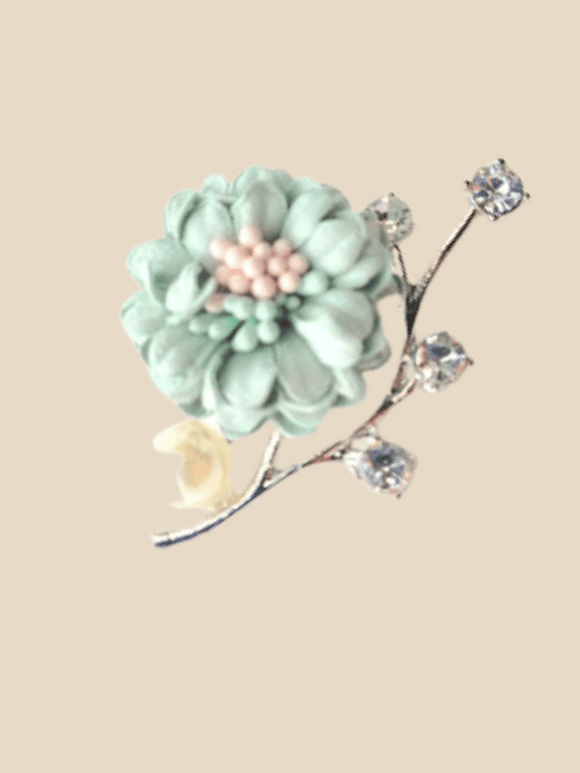 Mint green flower hijab brooch with silver color details and a pearl 